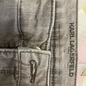 Size 12 Karl Lagerfeld Paris jeans with a straight fit classic faded dark wash.